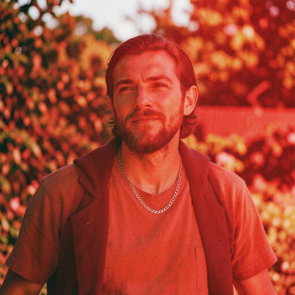 Candid documentary photograph of a person in gentle window light